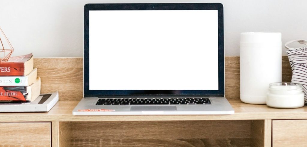 Turned-on MacBook on desk